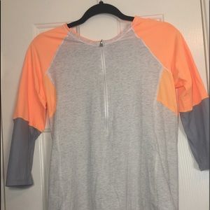 Orange and grey 1/2 zip shirt from lululemon.